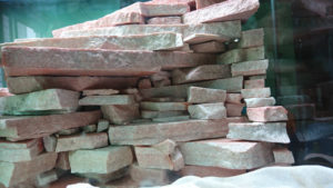 Shooting a stone from behind